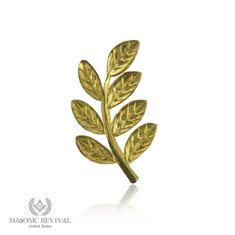 A sprig of acacia in gold, the Masonic symbol of the immortality of the soul